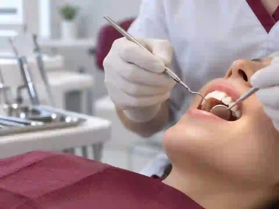 Professional teeth cleaning in a dental treatment room